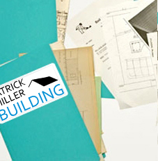A builder's site file folder containing project documents and plans.
